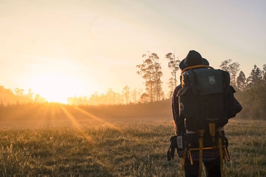 A tourist looking at sunrise