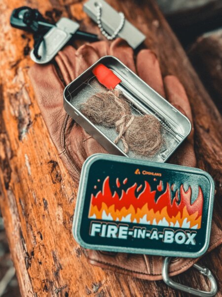 Pocket Survival Kit with Fire-Starting Gear — Ferro Rod and Tinder in a Compact Container. Photo: Rigad