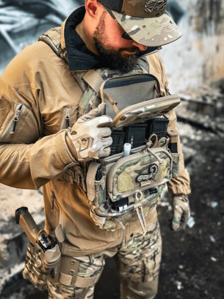 Equipment on the chest carrier with admin/medical pouch and a pistol in a thigh holster. Photo: Rigad