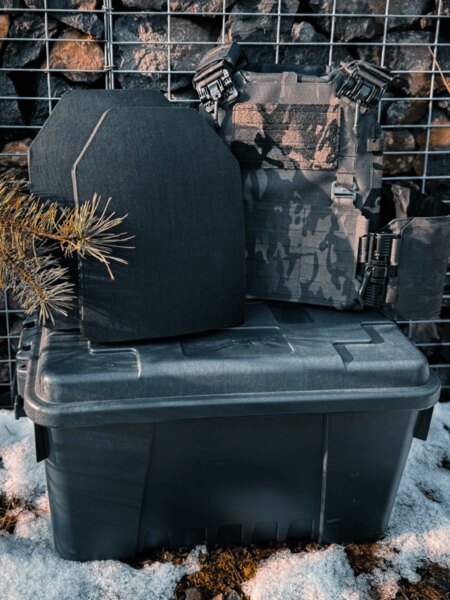 Two ballistic plates in front of the carrier on the transport box, winter environment; demonstration of operational and storage conditions.