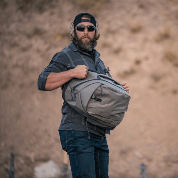 A man with an EDC crossbody backpack for CCW Helikon-Tex<sup>&reg;</sup> Sling. Photo: Helikon-Tex