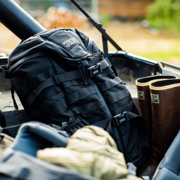 Black evacuation backpack stored in the trunk of an off-road vehicle. Photo: Rigad