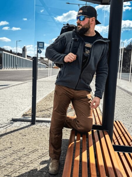 Man with a backpack ready for evacuation waits at the stop. Photo: Rigad