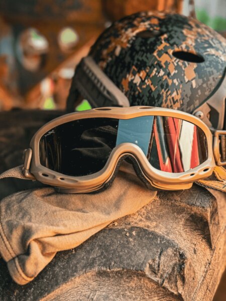 Tactical protective goggles placed on gear, helmet in the background; example of deployment in challenging terrain. Photo: Rigad