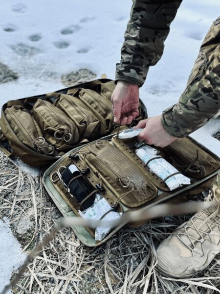 Medical backpack laid out in the field, neatly organized medical supplies for quick intervention. Photo: Rigad