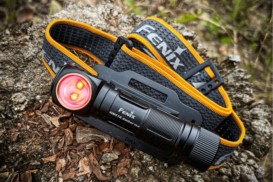 Fenix headlamp with powerful LED light laid on the ground, ready for night or adverse conditions. Photo: Rigad