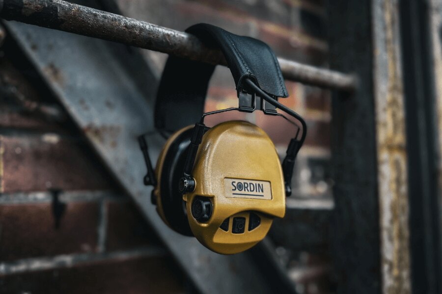 Active shooting earmuffs Sordin hung on a metal structure in an industrial environment. Photo: Rigad