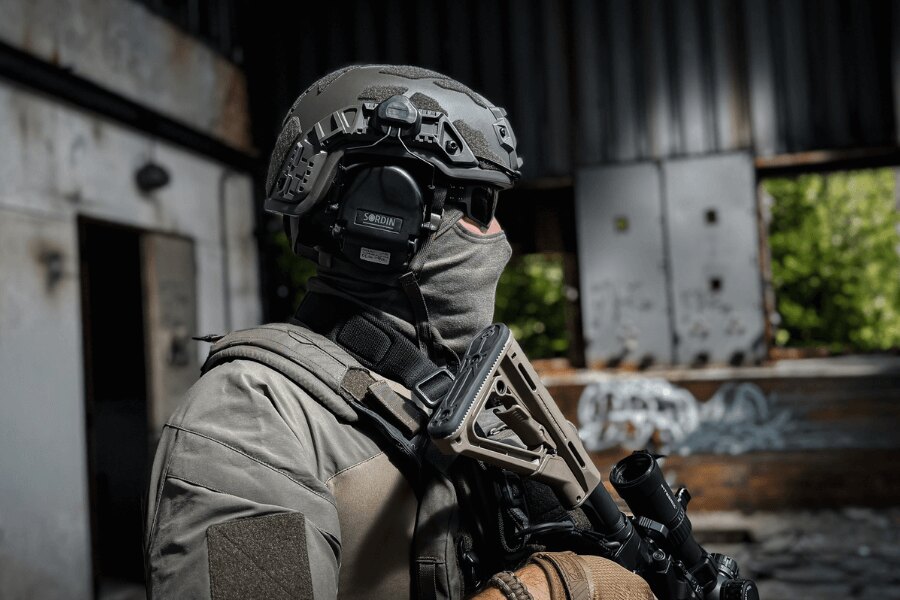 Shooter with active shooting headphones compatible with a ballistic helmet while shooting. Photo: Rigad