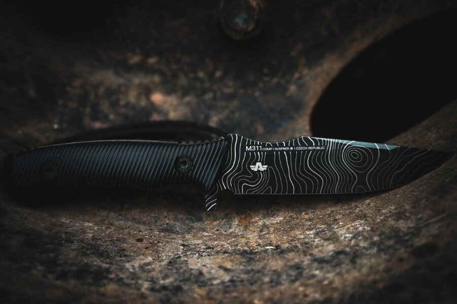ANV M311 knife with a DLC-coated blade featuring a topo pattern. Photo: Rigad