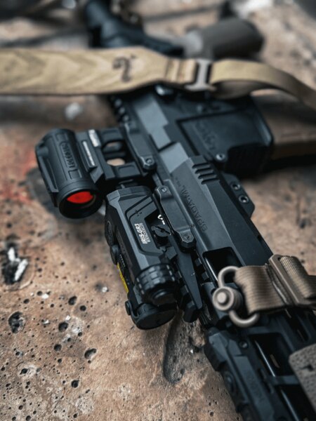Holosun red dot sight and IRIS IR laser mounted on a rifle, detail of setup and accessories, Photo: Rigad