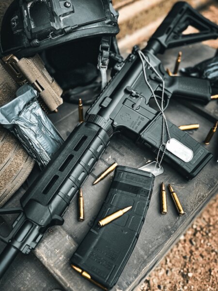 AR-15 semi-automatic rifle with a magazine and .223 Remington ammunition on a shooting bench, Photo: Rigad