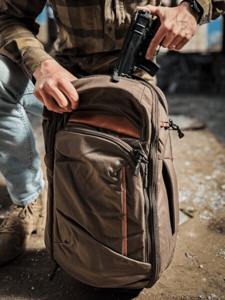 Vertx<sup>&reg;</sup> Gamut Backpack in Use While Handling Gear in an Urban Environment. Photo: Rigad