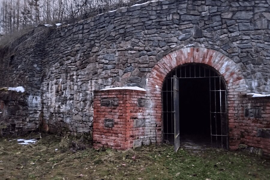 Entrance to Fort Radíkov — stone fortification wall and secured access point to the underground spaces.
