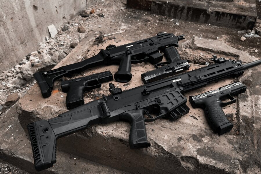 A selection of modern firearms by Česká zbrojovka displayed on a concrete surface. Photo: Rigad
