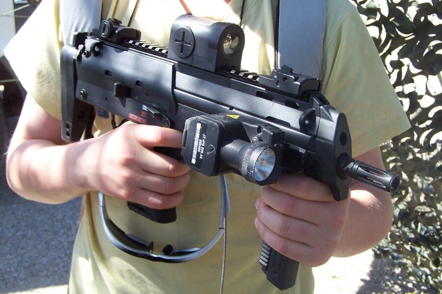 Heckler &amp; Koch MP7 Held in Hand, Compact PDW with Red Dot Sight and Tactical Light