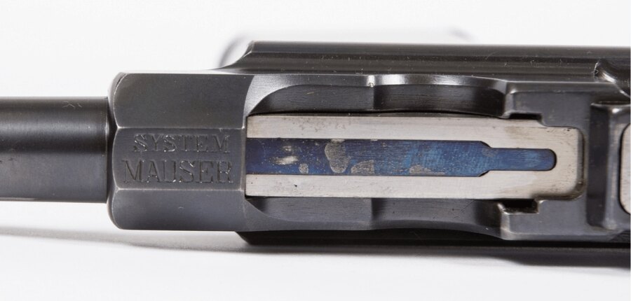 Close-up of the Mauser C96 pistol slide with the “System Mauser” marking