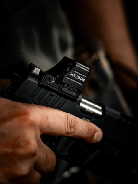Holosun 407COMP pistol red dot sight mounted on a handgun