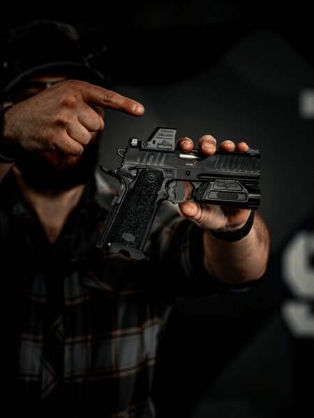 Close-up of the Holosun 407C-X3 pistol red dot mounted on a handgun
