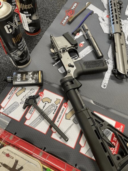 Disassembled Schmeisser AR15-9 PCC carbine during cleaning and maintenance