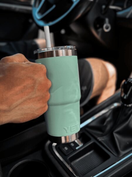 YETI Rambler insulated tumbler in a vehicle cup holder during travel