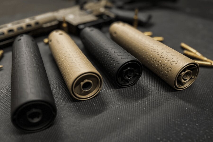 AR-style rifle fitted with a sound suppressor in an industrial environment.