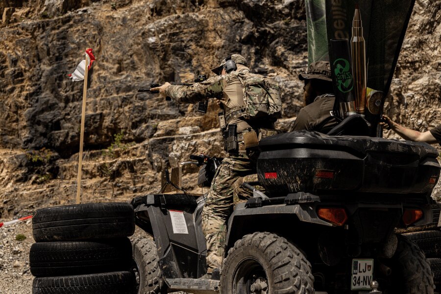Competitor engaging targets from a moving ATV during a Lynx Brutality 2026 stage at the Kočevje shooting range.
