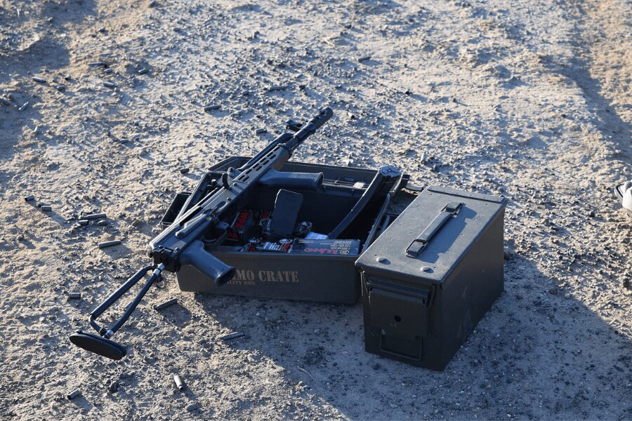 Hungarian AMD-65 assault rifle resting on an open ammunition crate.