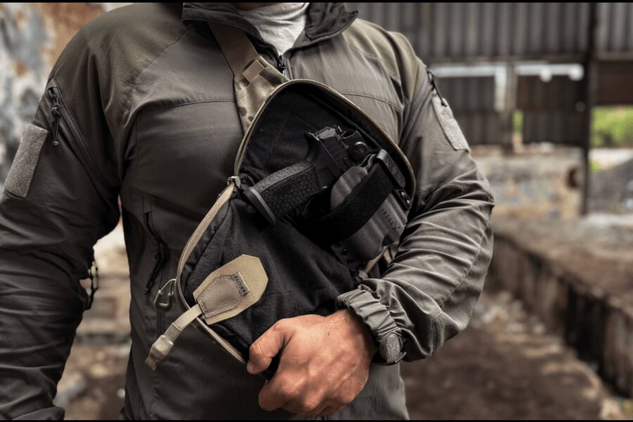 Handgun secured in an Agilite CCW Insert inside an open chest-worn fanny pack.