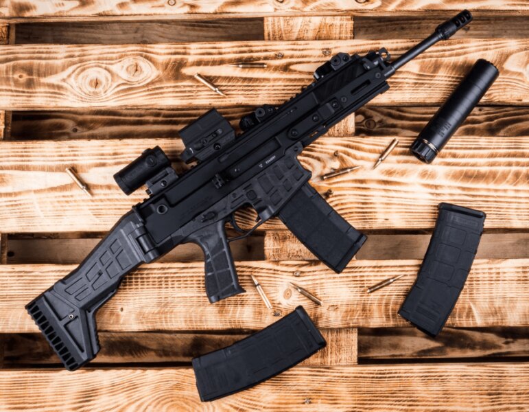 CZ BREN 2 semi-automatic rifle with a red dot sight, magnifier, and suppressor.