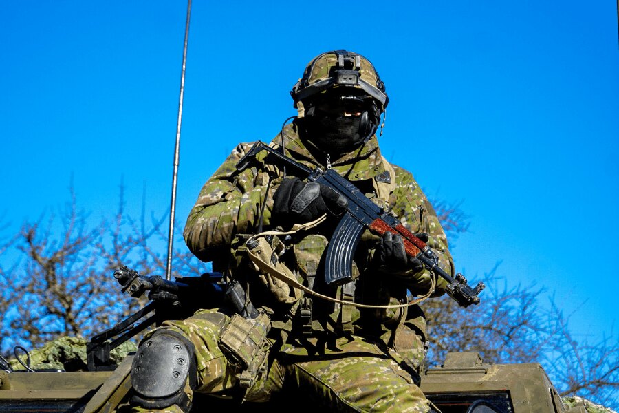 Soldier carrying a Sa vz. 58 rifle during military training.