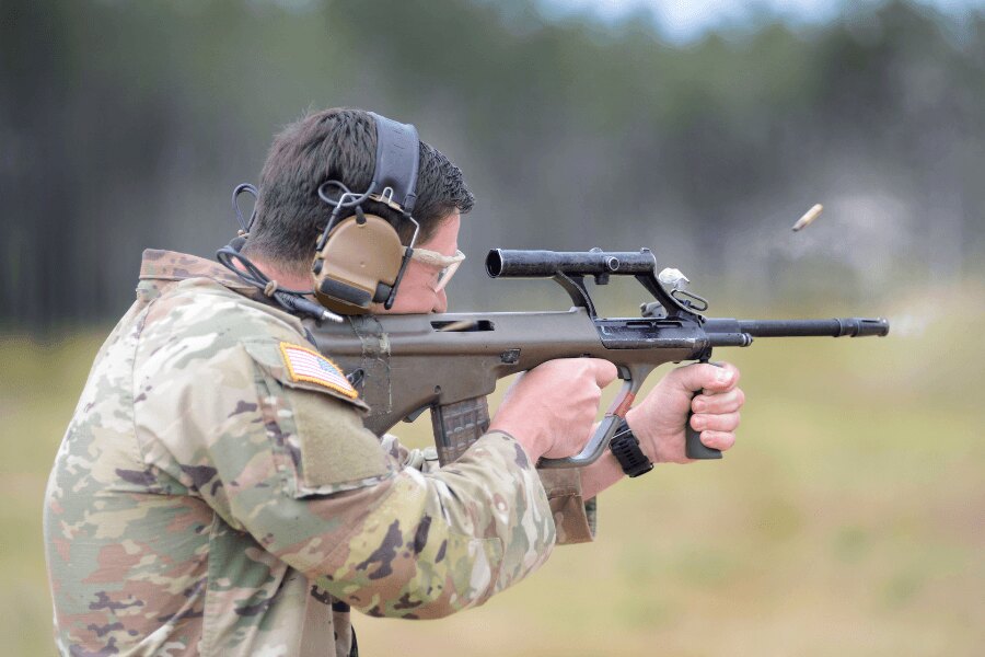 Soldier with a Steyr AUG rifle during live-fire training.