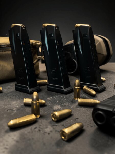 Three Glock pistol magazines and 9×19 mm cartridges.