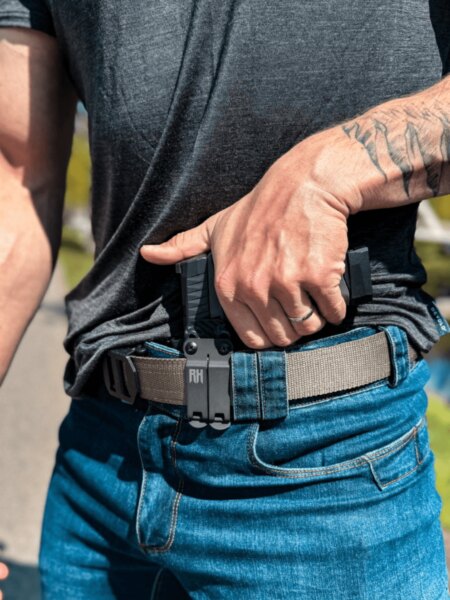 Drawing a handgun from an RH Holsters IWB holster in the appendix carry position.