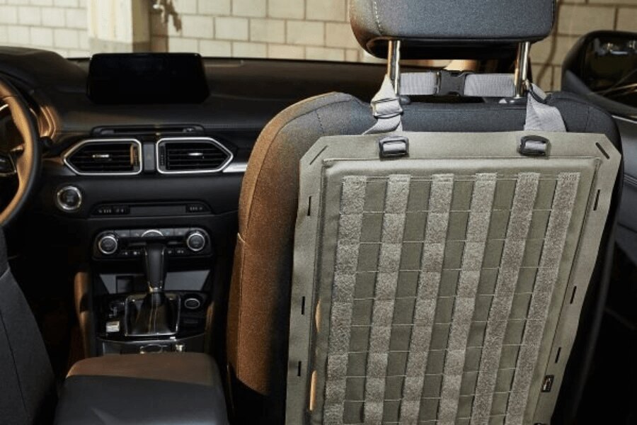 Tasmanian Tiger TacVec Auto Front Seat MOLLE panel attached to the back of a vehicle seat.