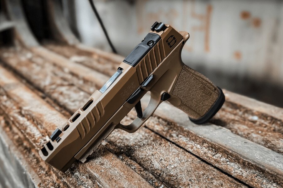 SIG Sauer P365 pistol with iron front and rear sights placed on a wooden table.
