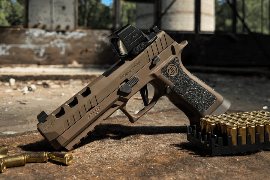 SIG Sauer P320 DH3 pistol with a Holosun collimator lying next to ammunition.