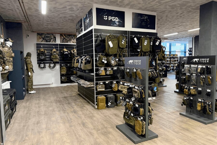 Tactical equipment, backpacks, and pouches displayed inside the Rigad store in Olomouc.